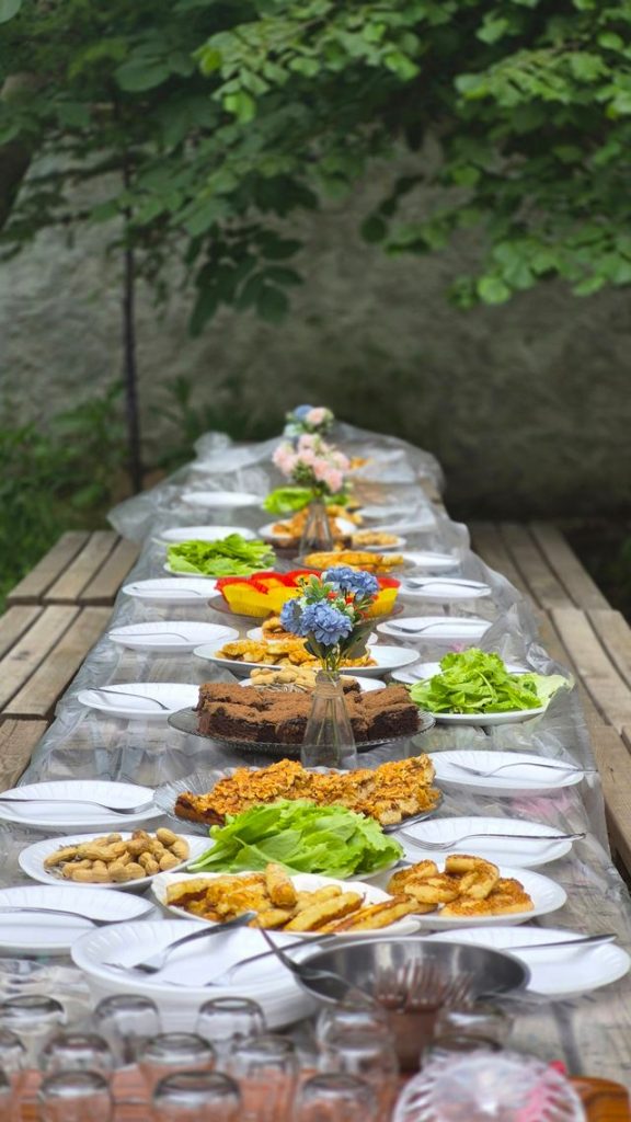 pexels photo 38075093 38075093 Long outdoor table set with an array of fresh dishes, perfect for summer gatherings.